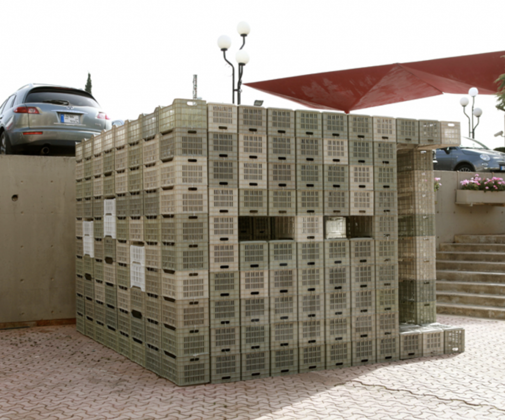 structure made of milk crates from designboom https://www.designboom.com/architecture/lau-architecture-students-assemble-emergency-shelter-plastic-crates-ties-04-30-2014/