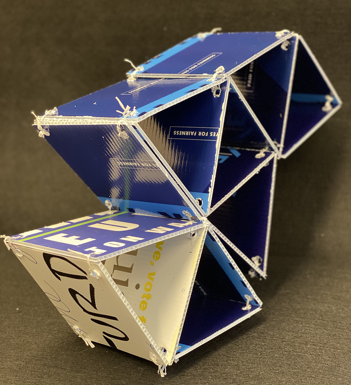 plastic square building blocks into a shape of triangles, blue and white